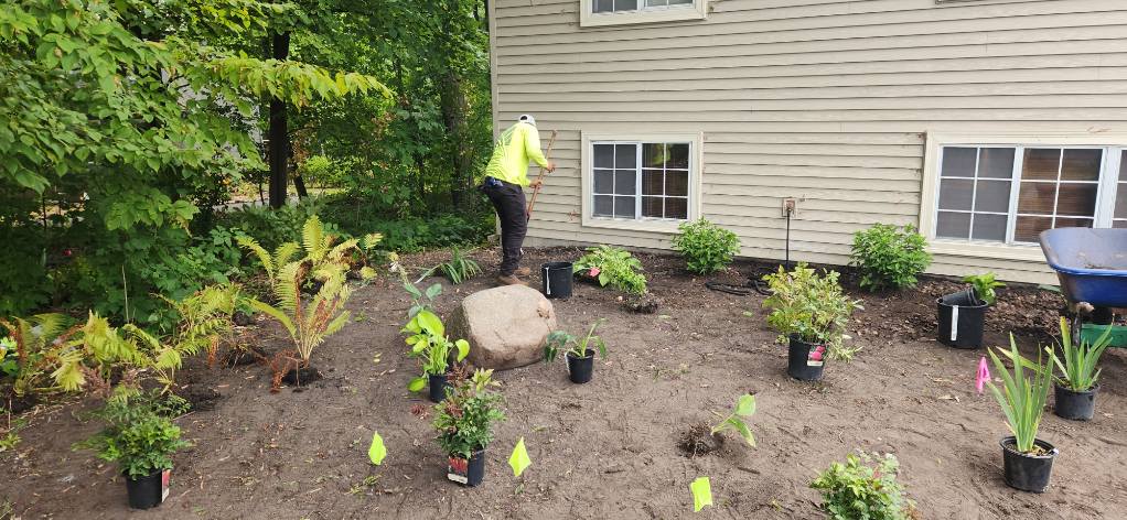 Spring and fall landscape cleanup service preparing gardens for Minnesota seasons